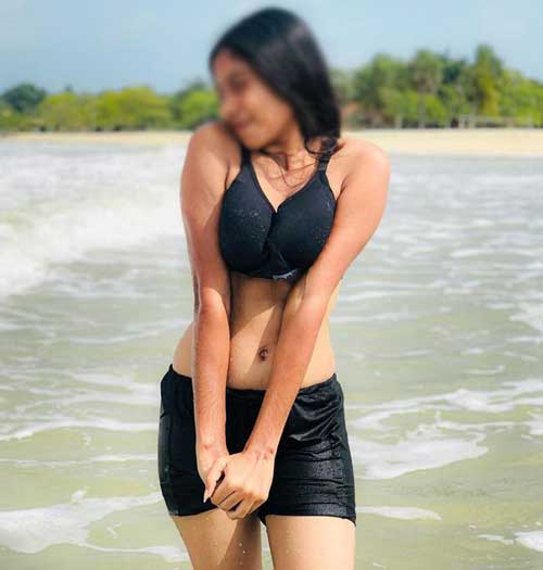 sexy girl in black bra and shorts enjoying at the beach